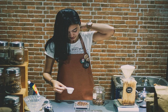A barista carefully preparing a latte at Velvet Roast, focus on the crafting process.